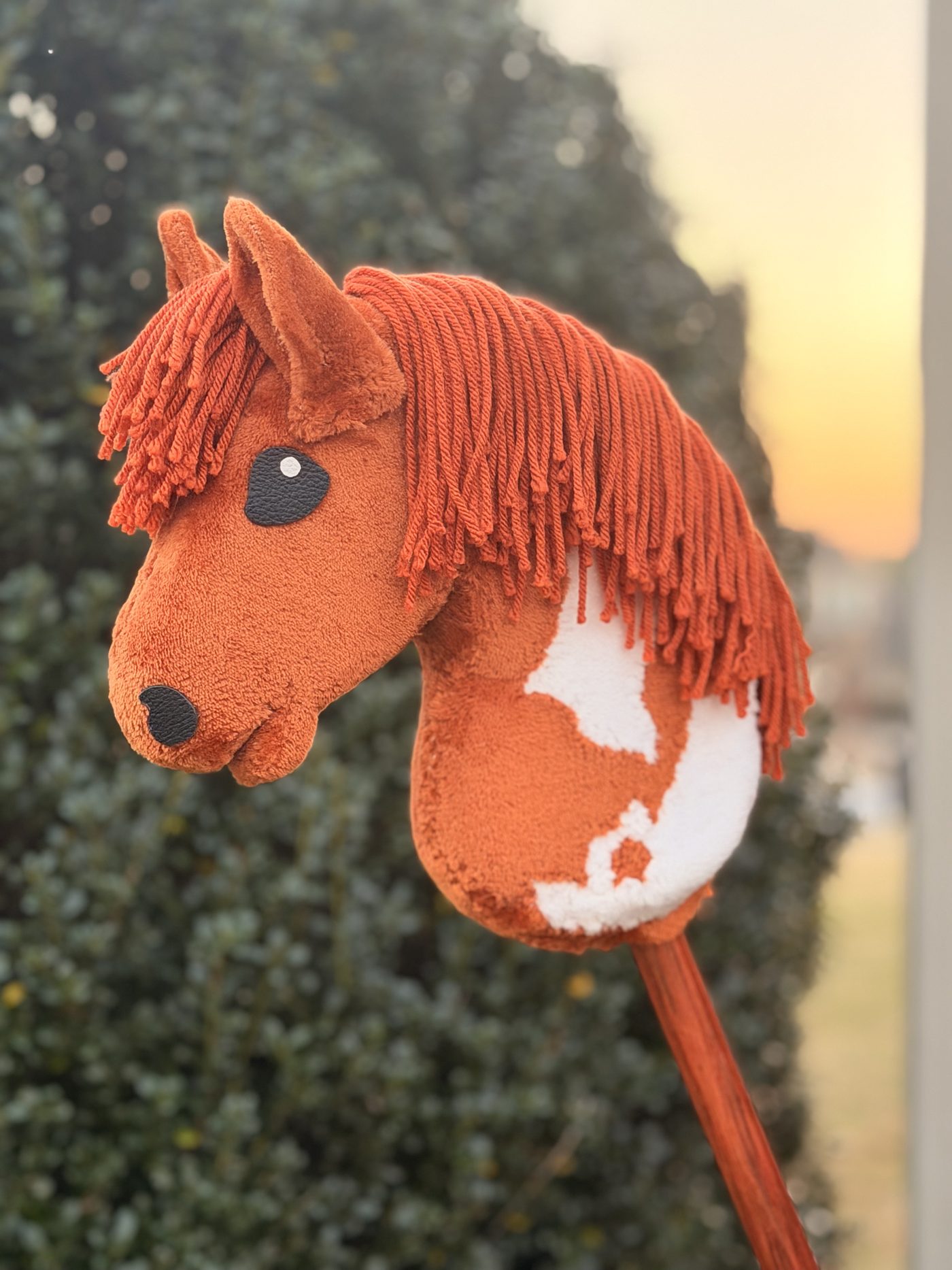Handmade chestnut and white paint hobby horse with a yarn mane